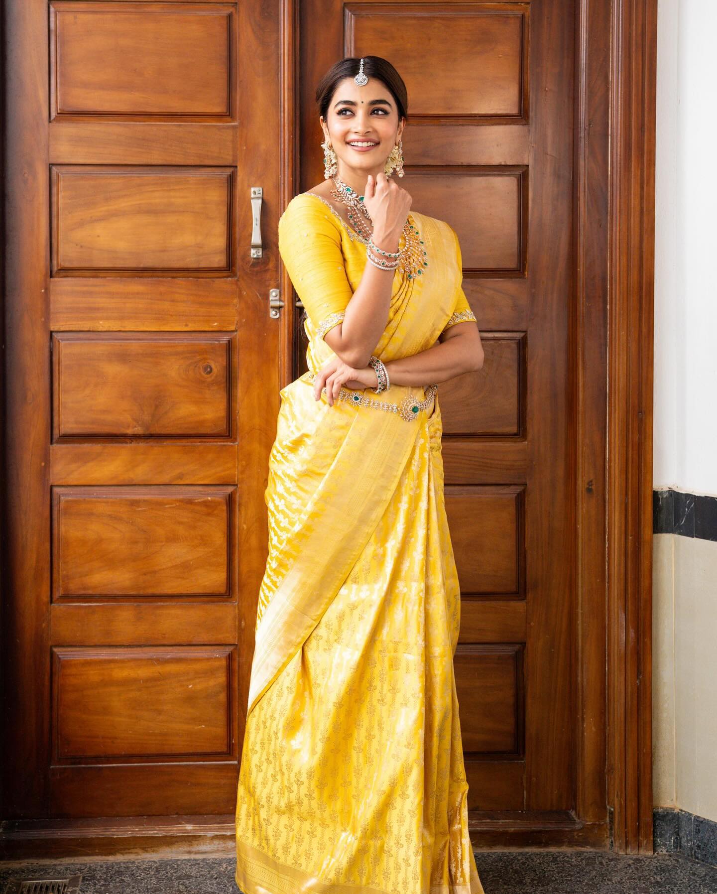 Pooja Hegde Cute Cleavage Exposed In Yellow Bare Back Saree